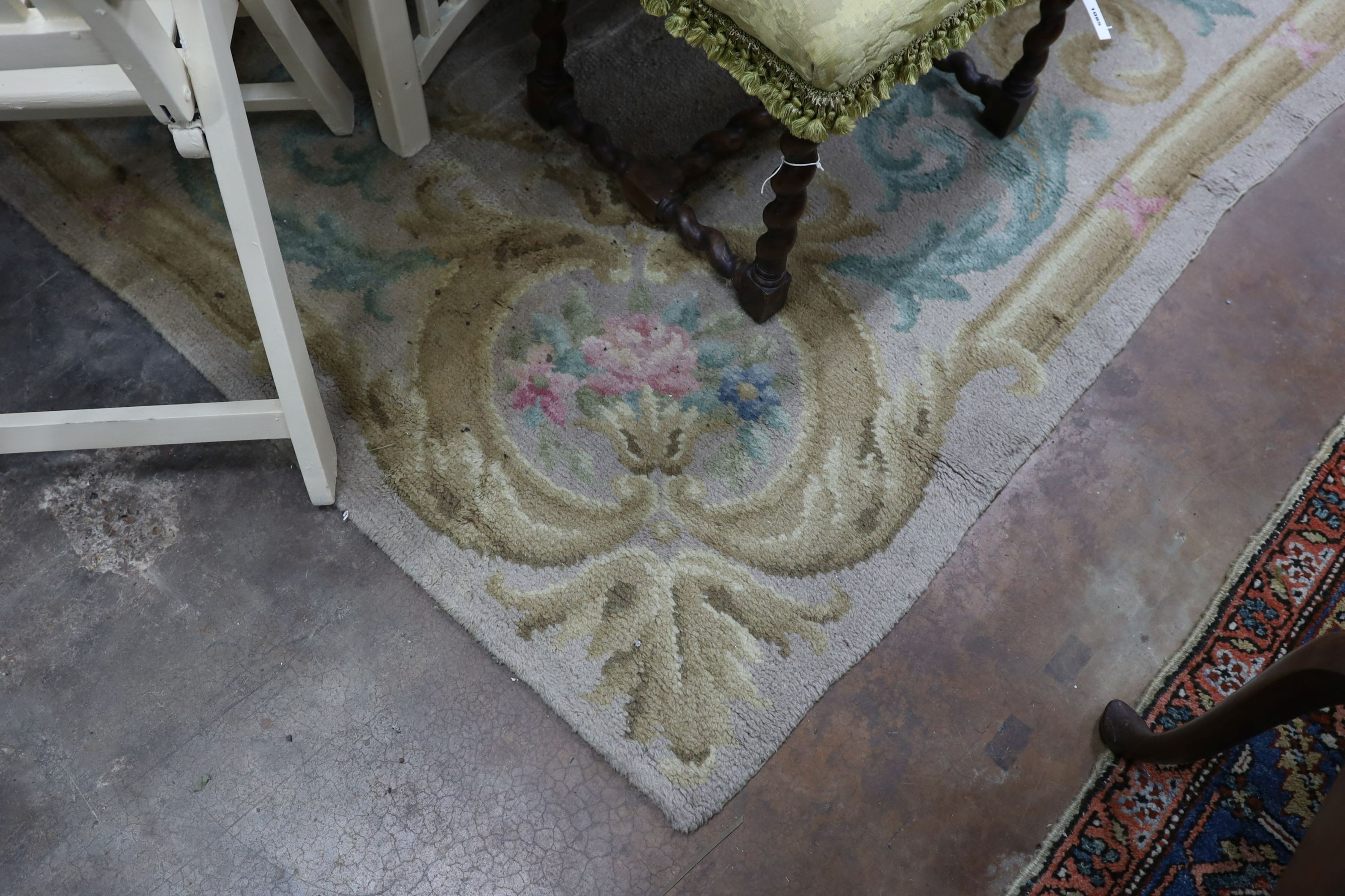 An Aubusson style fawn ground wool carpet, 360 x 260cm